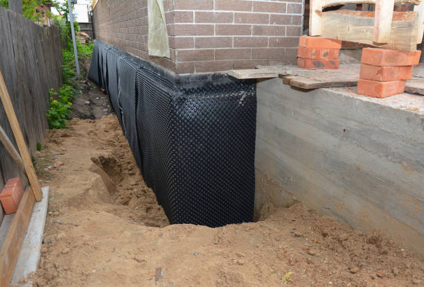Happy homeowners after waterproofing job in Blanford